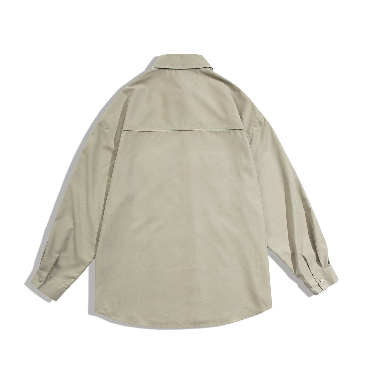 Back view of a light beige long-sleeve shirt with a pointed collar, buttoned cuffs and a horizontal shoulder yoke.