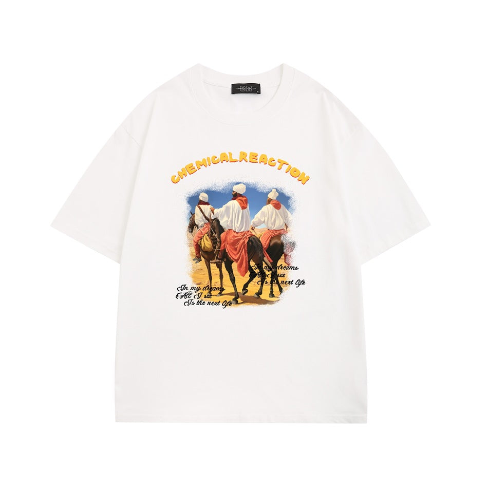 White short-sleeve T-shirt with desert riders on horseback graphic and yellow CHEMICAL REACTION lettering