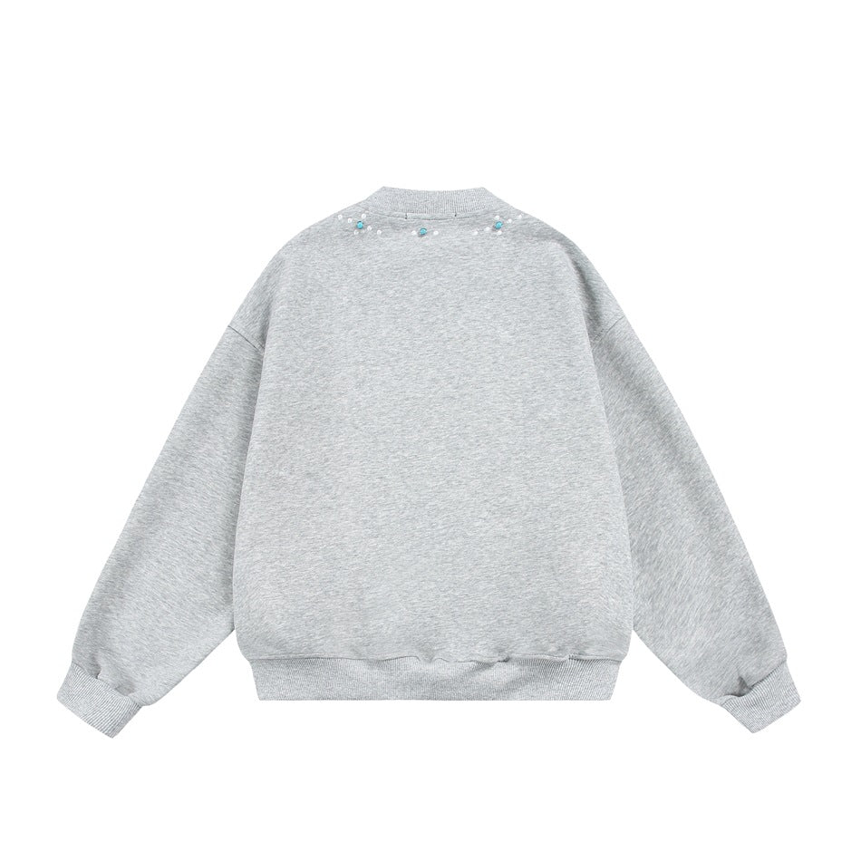 Heather gray sweatshirt, back flat lay, with small white and turquoise-colored beads at the back neckline