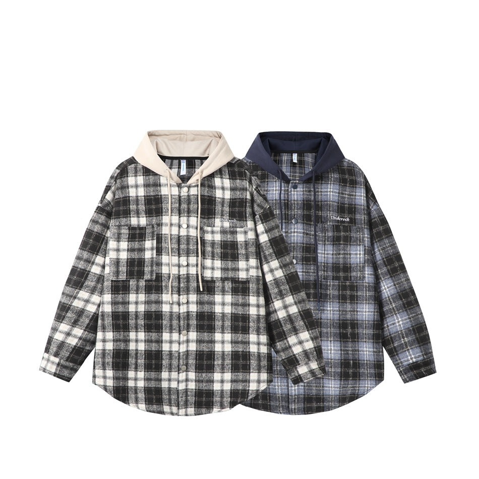 Two flat-lay hooded plaid overshirts, one black, gray, and white with a beige hood, and one blue and black with a navy hood.