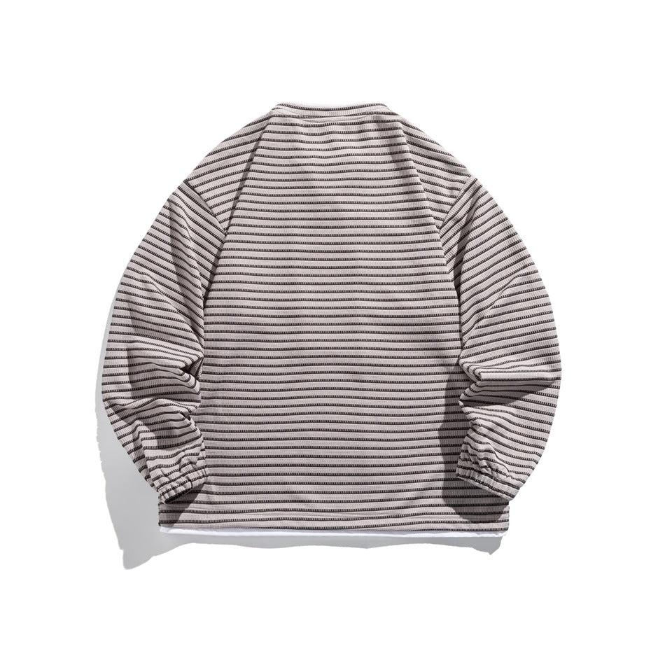 Back view of gray-beige striped long-sleeve pullover with crew neck, elastic cuffs and white layered hem, flat lay