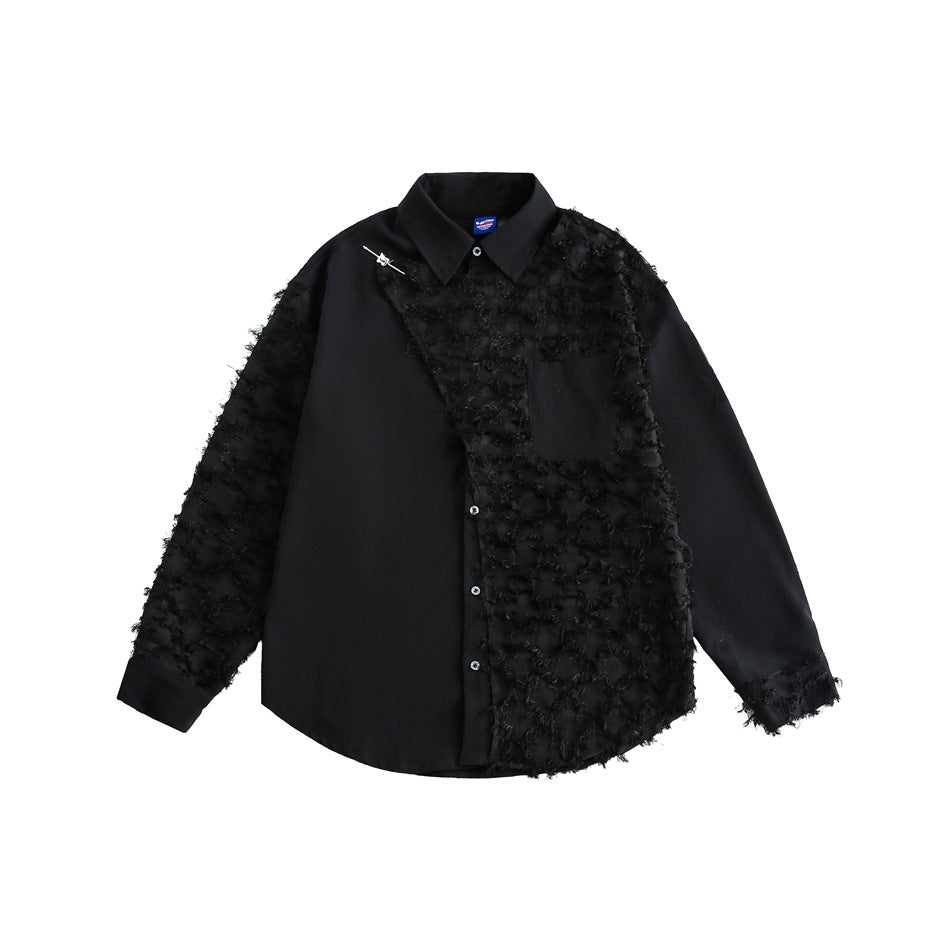 Black long-sleeve shirt with a frayed fringe panel on one side, a chest pocket and a small metal pin at the collar