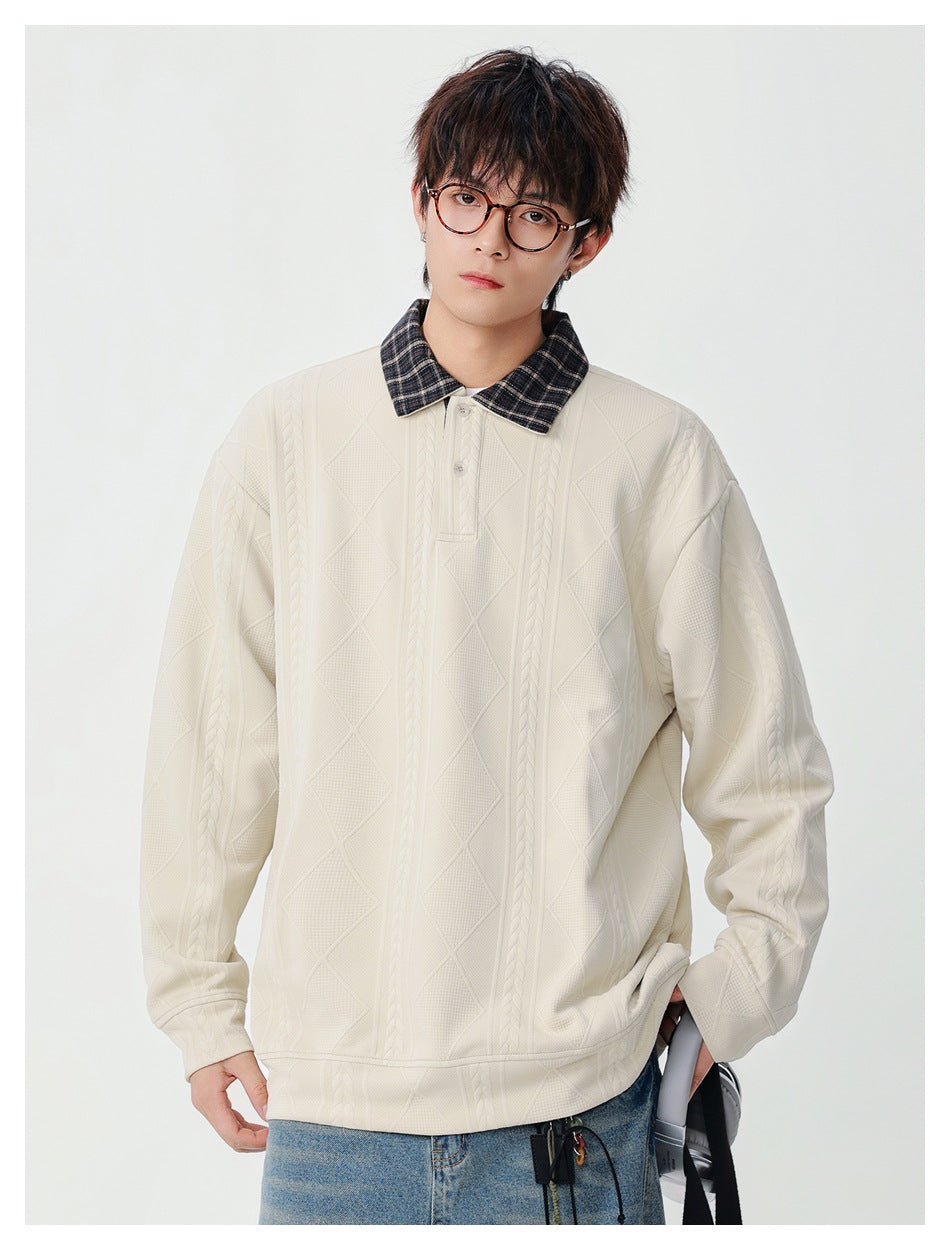 Model wearing off-white textured pullover with plaid polo collar and two-button placket, with jeans, front view