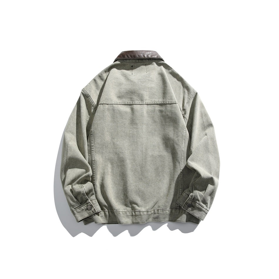 Back view of a gray-green jacket with a dark brown collar, seam detailing, and buttoned cuffs.