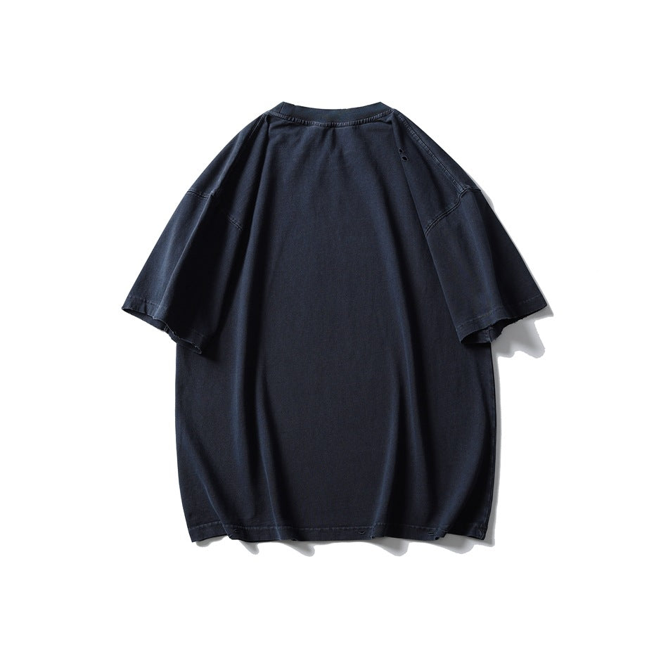 Back view of an oversized dark navy short-sleeve T-shirt with a crew neck and distressed hem details.