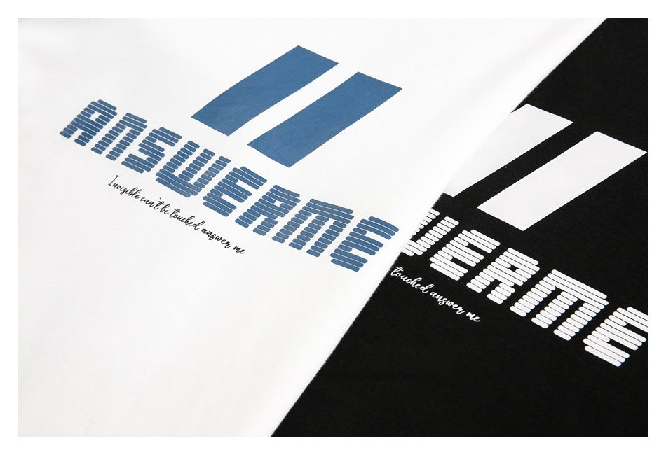 Close-up of blue and white graphic prints on white and black sweatshirt fabric.