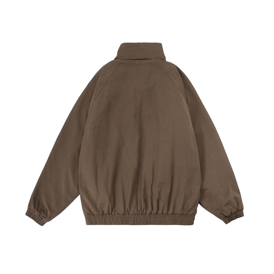 Back view of a brown jacket with a high collar, raglan sleeves, and elasticated cuffs and hem.