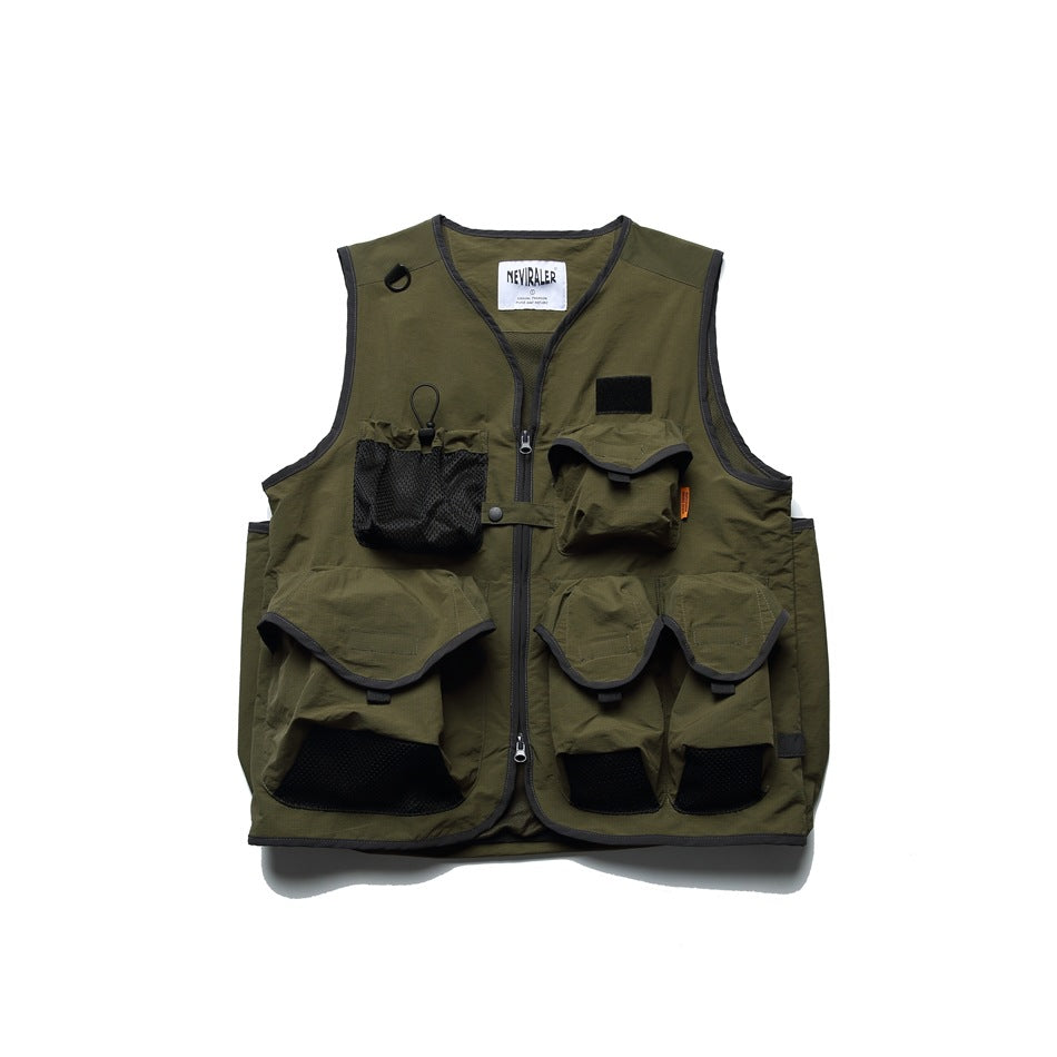 Olive sleeveless utility vest shown from the front with a zipper, mesh pockets, and multiple flap pockets.