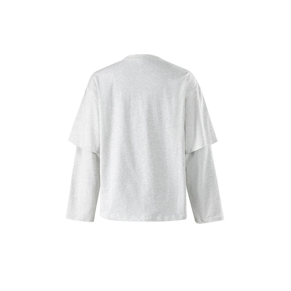 Back view of a plain light gray T-shirt with short sleeves layered over long sleeves.