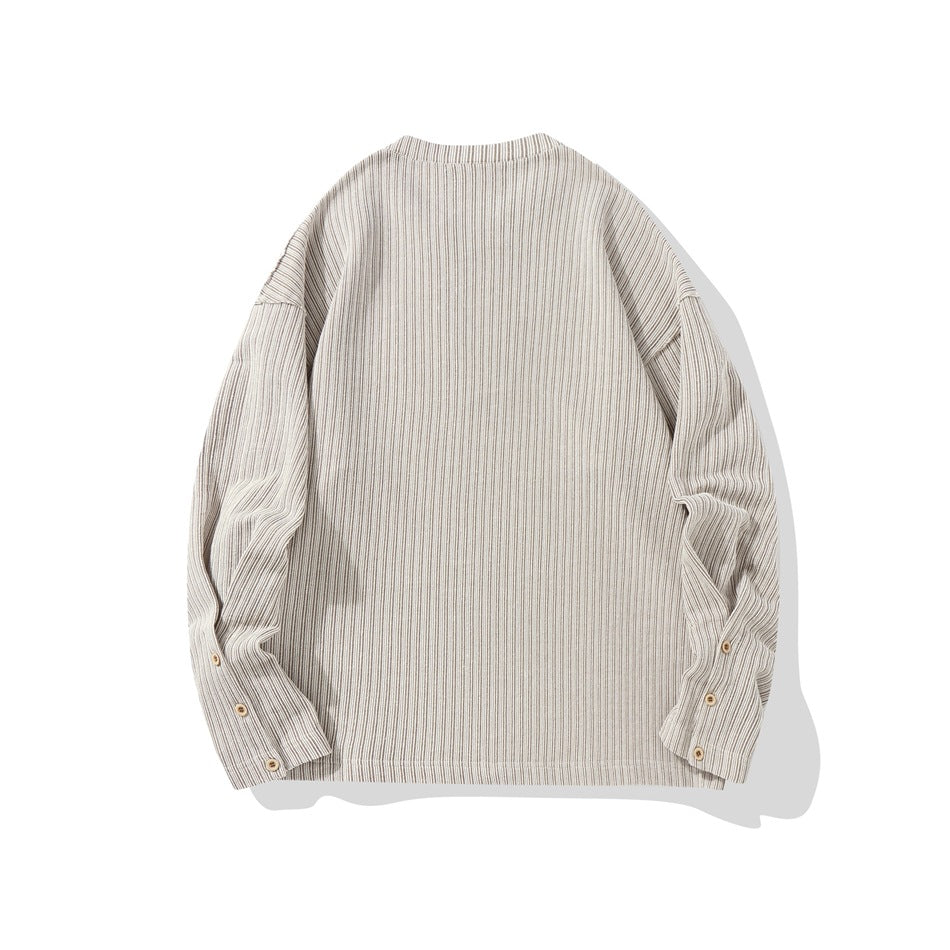Back view of beige vertical-striped long-sleeve pullover with drop shoulders and buttoned cuffs, flat lay