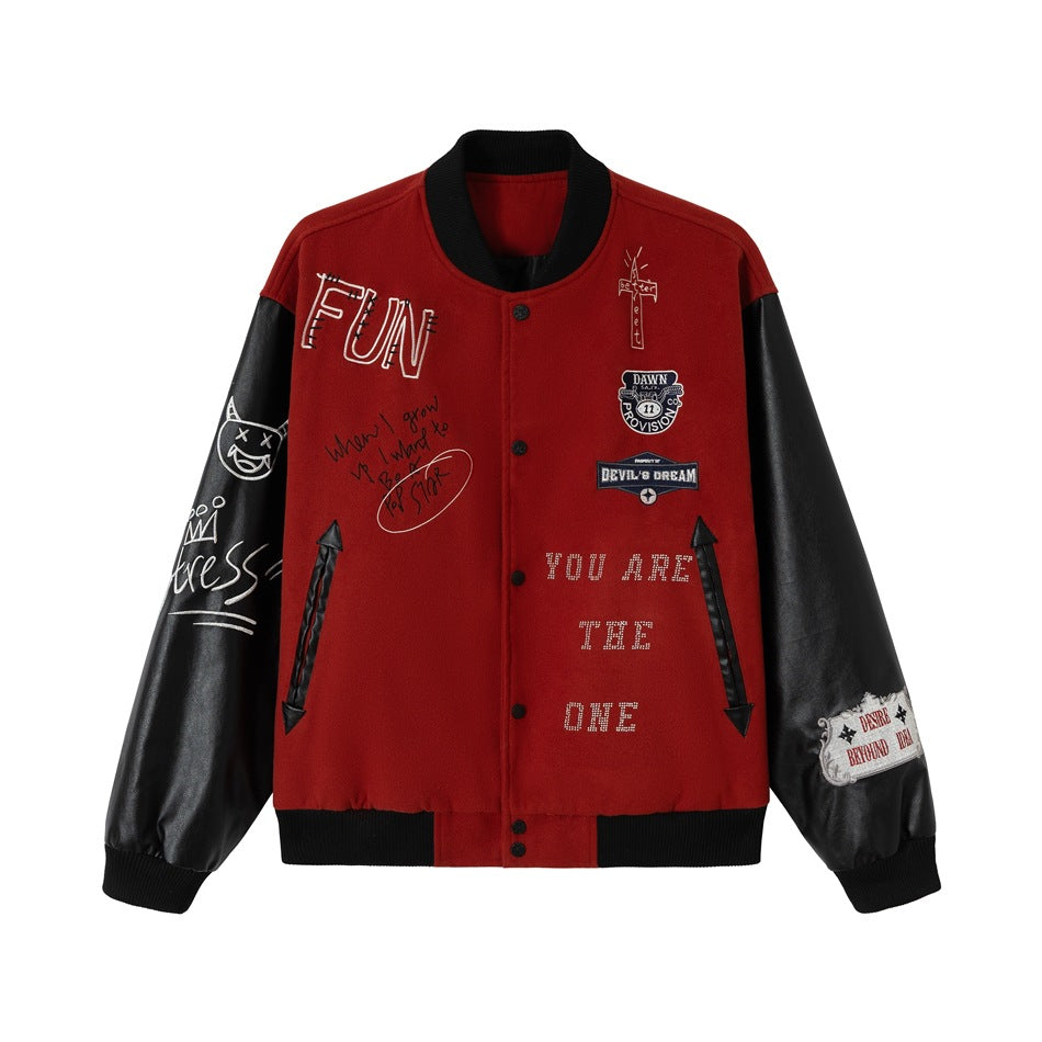 Red varsity jacket with black leather-look sleeves, ribbed trim, snap front, embroidered graffiti and patches
