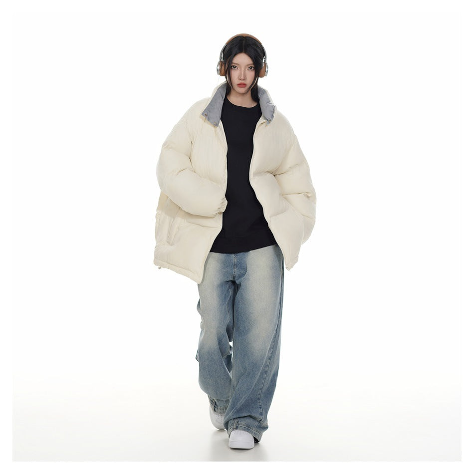 Model wearing an open ivory puffer jacket with a gray-lined collar, shown from the front.