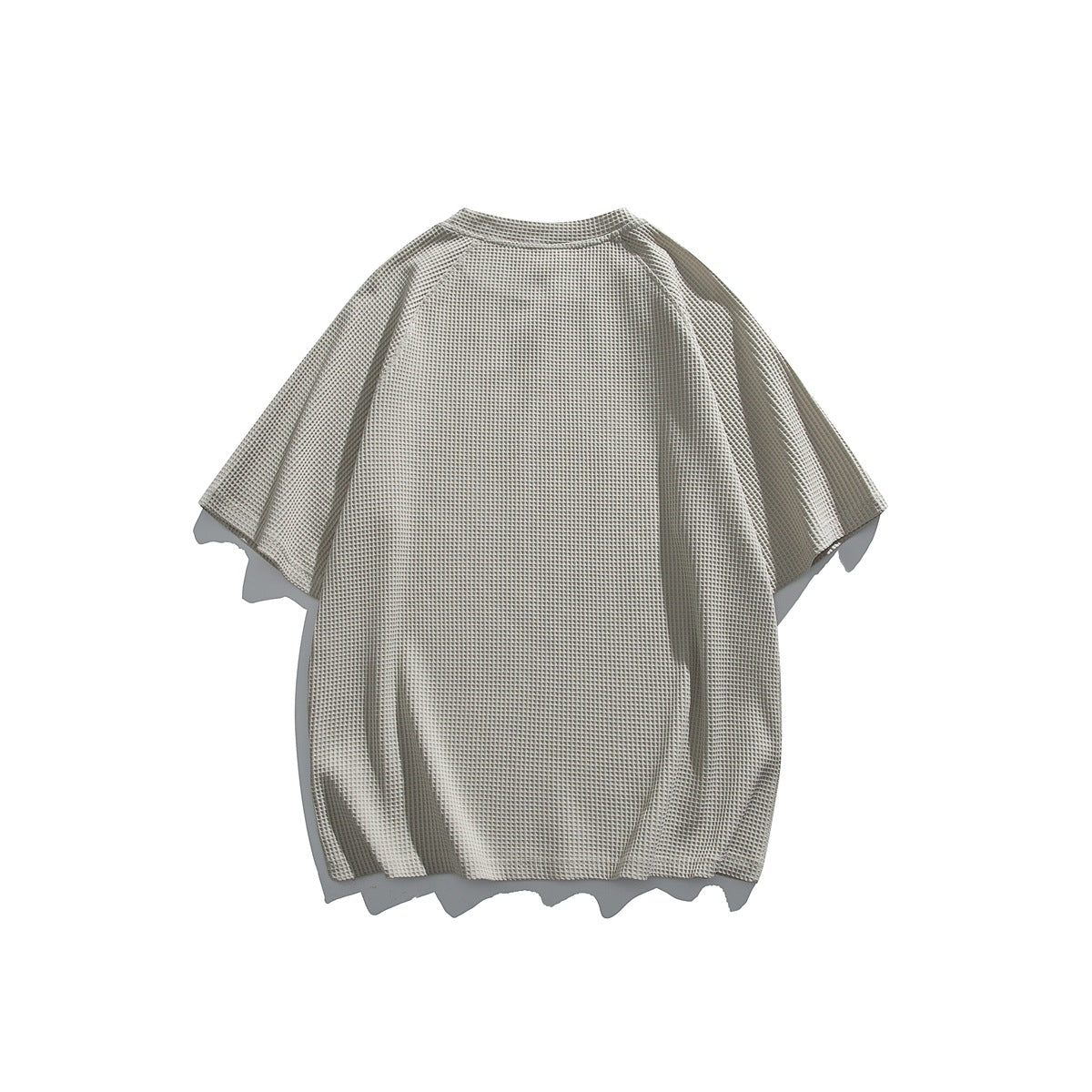Back view of a light gray waffle-knit raglan short-sleeve T-shirt laid flat