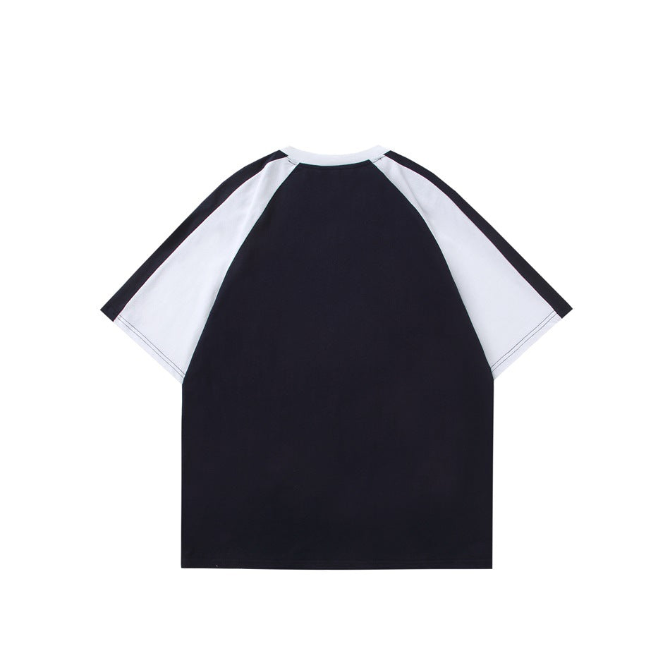 Back view of navy raglan T-shirt with white sleeves and white collar, flat lay