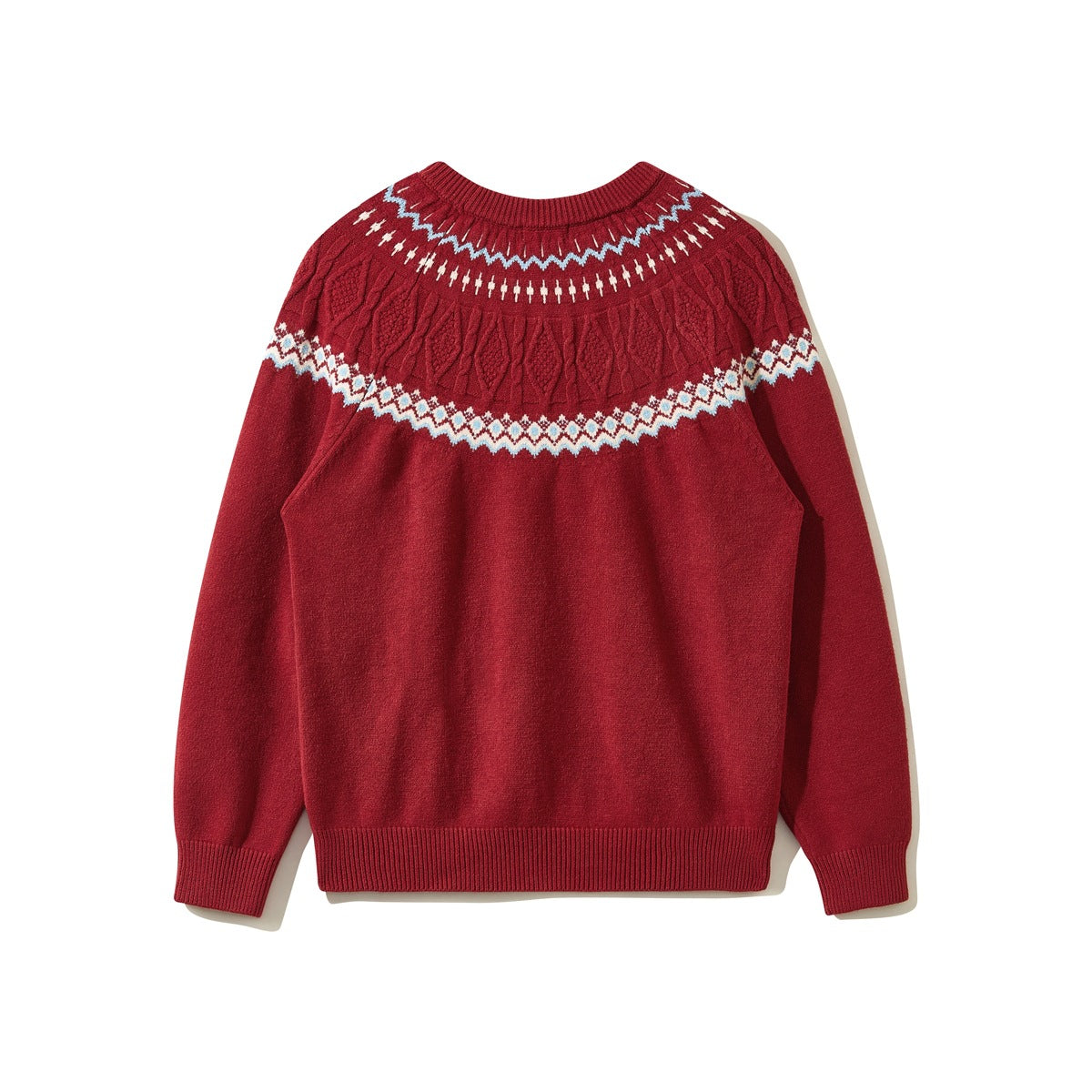 Back view of a red crewneck sweater with a blue-and-cream patterned cable-knit yoke and ribbed trim.