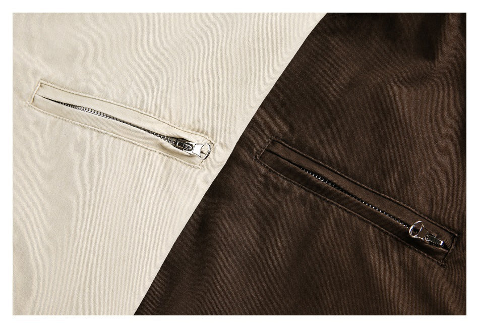 Close-up of cream and dark brown jacket fabric, each with a diagonal zippered pocket.