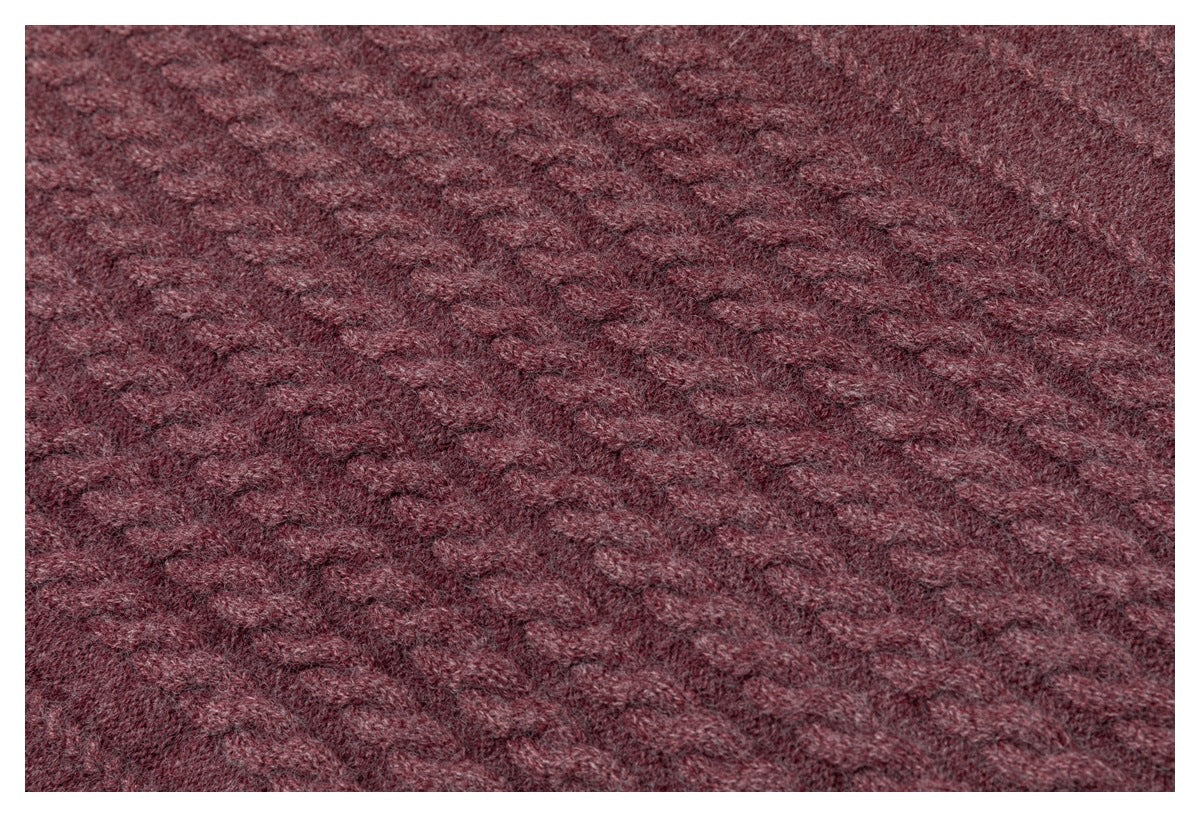 Close-up showing the raised cable-knit texture of a burgundy garment.