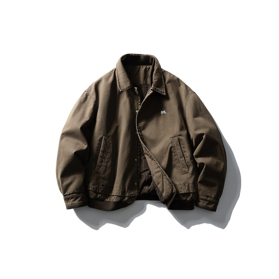 Front view of a brown collared jacket with button closure, two slanted pockets, and dark ribbed cuffs and hem.