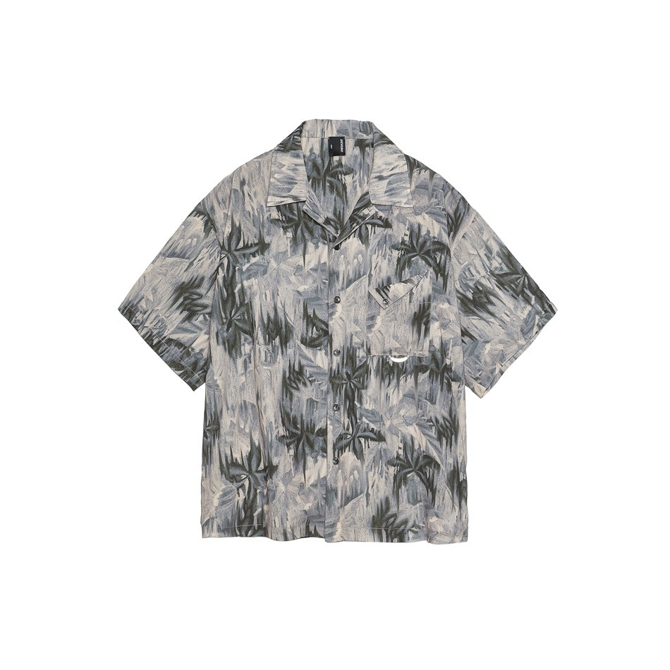 Front of a short-sleeve camp-collar shirt with gray, beige and olive abstract palm print and a chest pocket