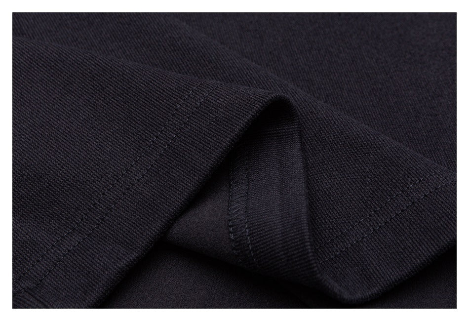 Close-up of a dark garment hem and inner seam stitching.