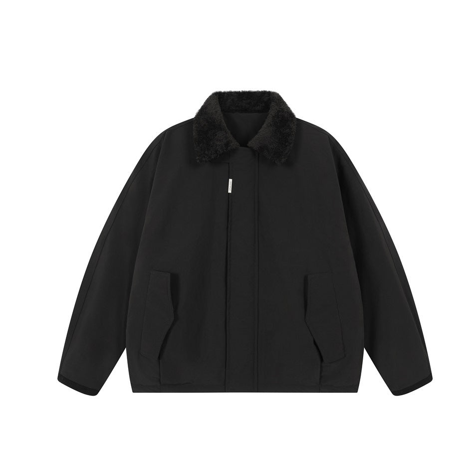 Black jacket with dark fleece-like collar, concealed front placket, flap pockets and ribbed cuffs, flat lay