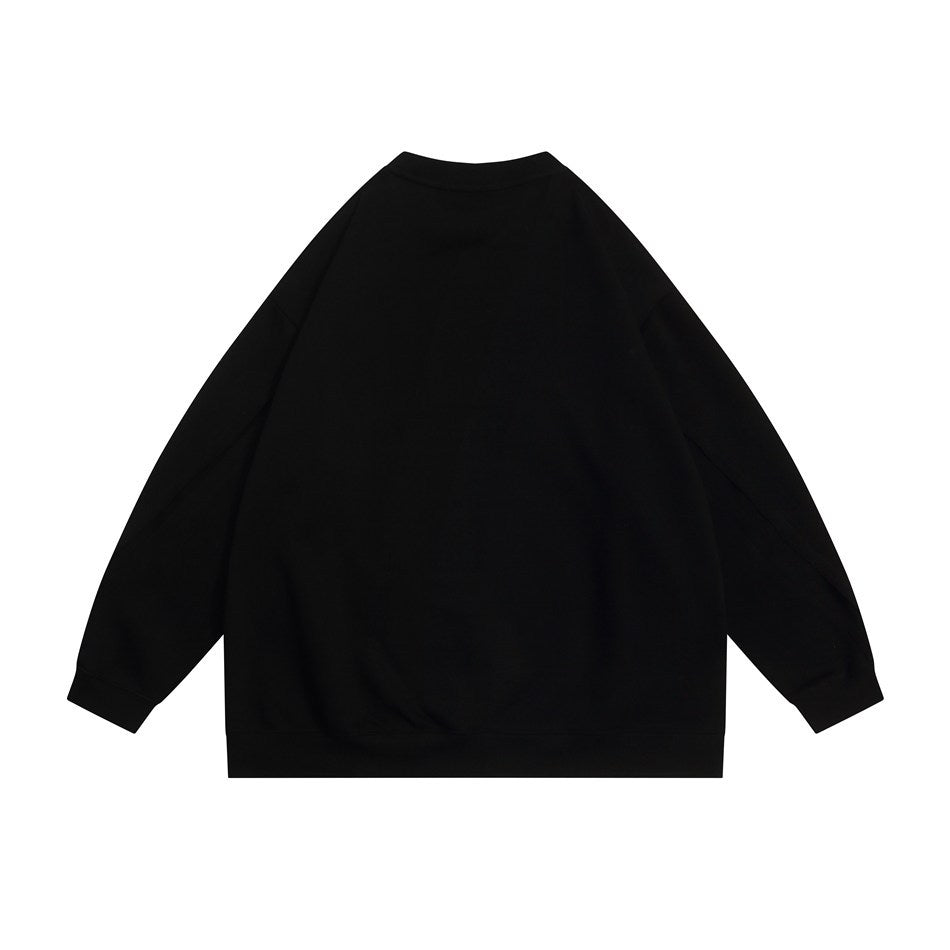 Back view of a plain black crewneck sweatshirt with long sleeves and ribbed cuffs and hem.