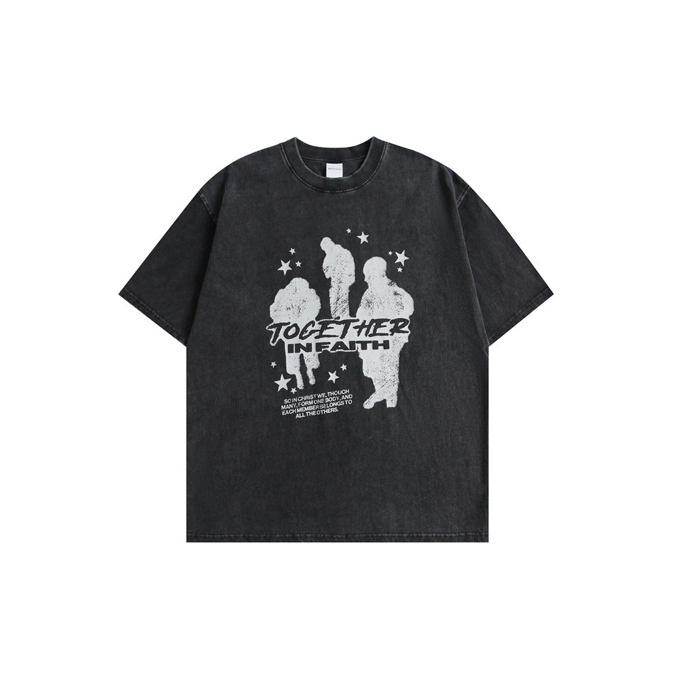 Washed black short-sleeve t-shirt with a white 'Together in Faith' silhouette and star graphic, flat lay