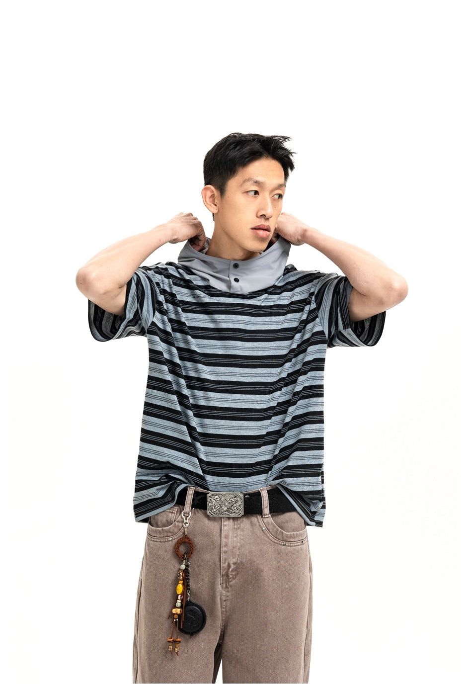 Model wearing a black and gray striped short-sleeve hooded top with a light gray buttoned neck panel.