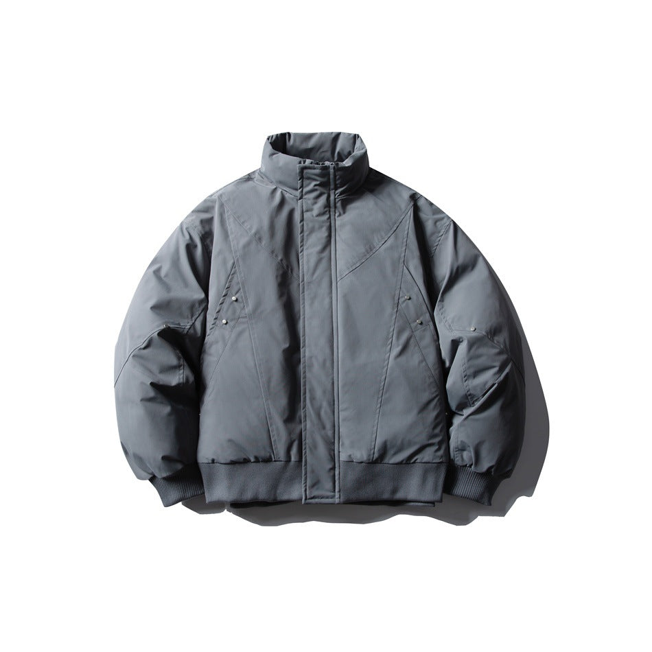 Gray-blue stand-collar zip jacket, flat front view, with diagonal seams, metal studs and ribbed cuffs and hem