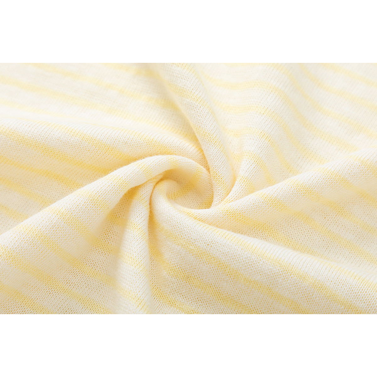 Close-up of the cream and pale yellow striped knit fabric gathered into a twist.