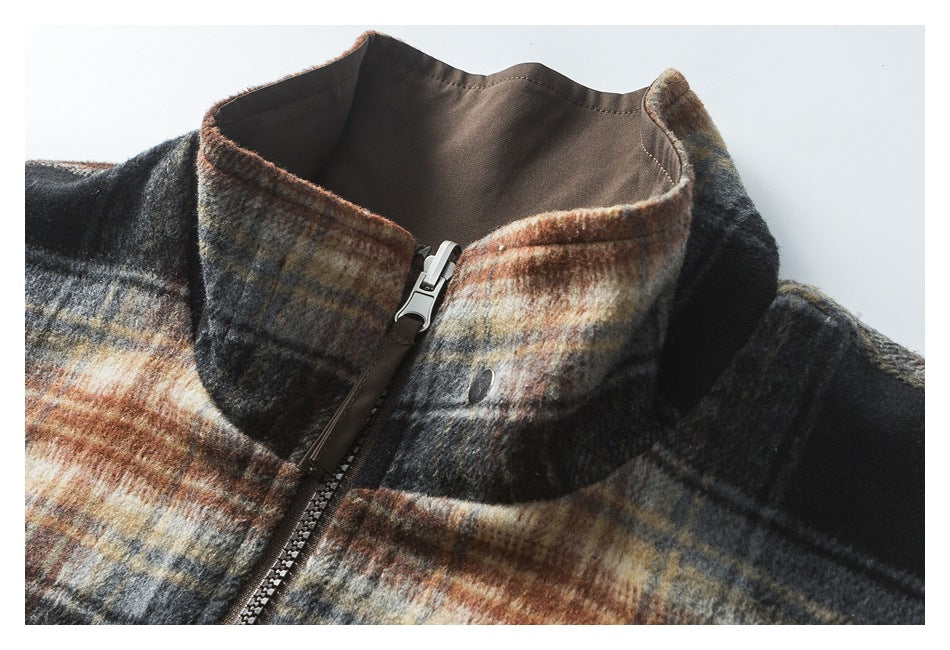 Close-up of the jacket's plaid stand collar, brown lining, and front zipper with a silver pull.