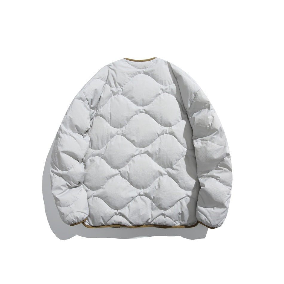 Back view of a light gray quilted jacket with a repeating wavy pattern and olive-brown trim.