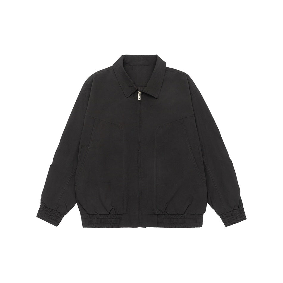 Black collared zip-front jacket flat lay with curved front seams and elastic cuffs and hem