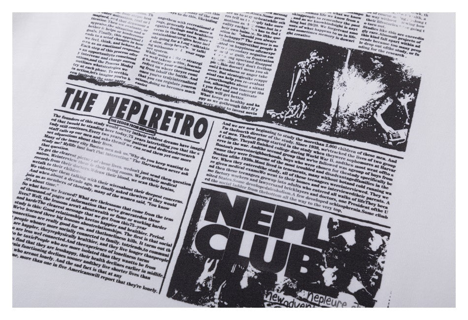 Close-up of a white garment with a black newspaper-style graphic and large English lettering.