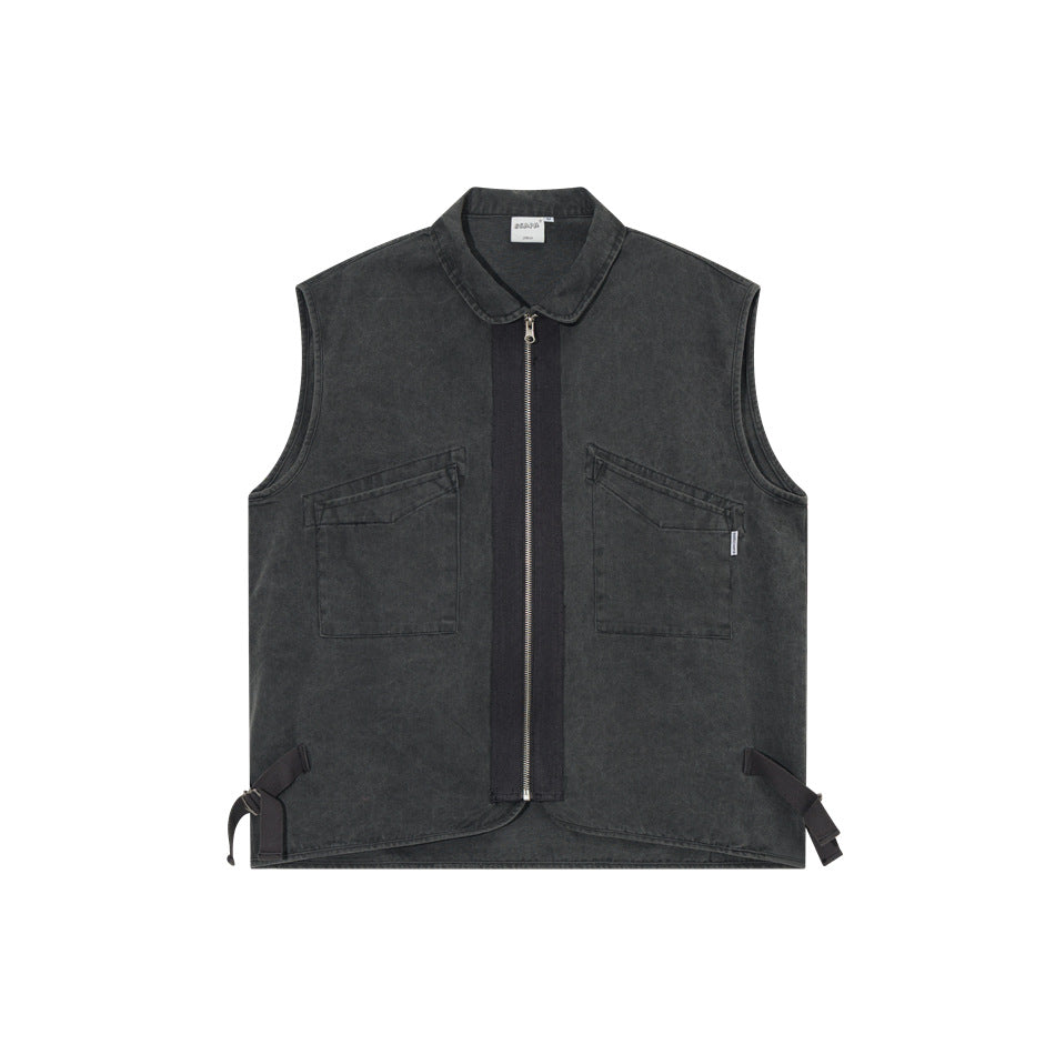 Black washed sleeveless zip vest with two flap chest pockets and side buckle straps, front flat view