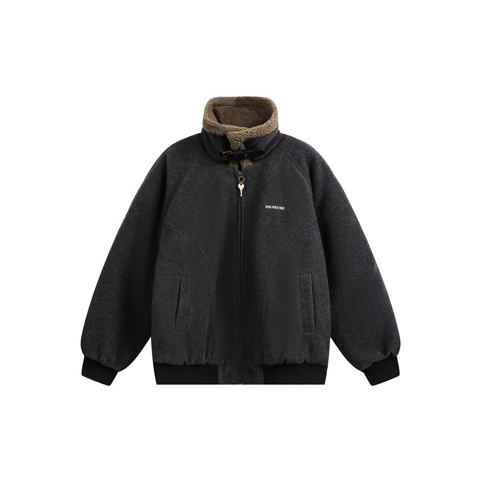 Dark gray zip jacket with tan fleece-like stand collar, black buckle strap, black ribbed cuffs and hem