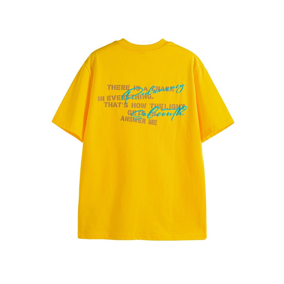 Back view of a yellow short-sleeve T-shirt with layered block and cursive text graphics.