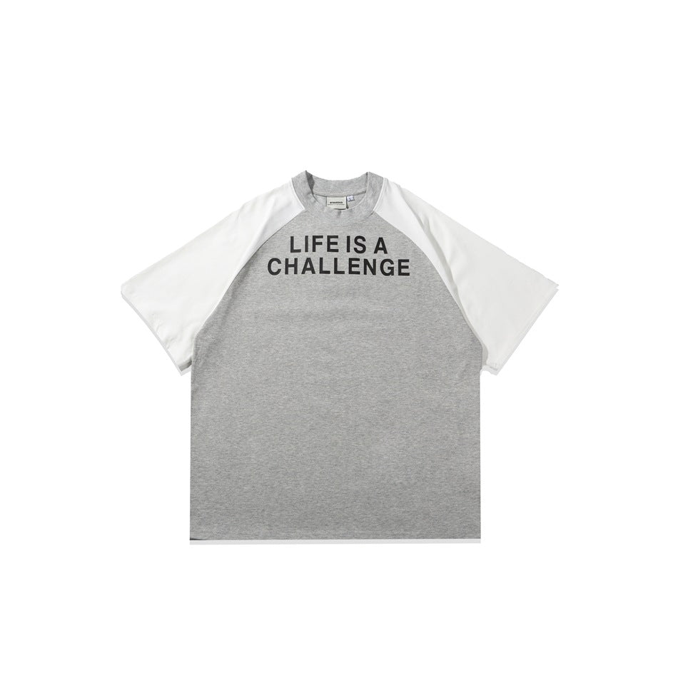 Heather gray raglan T-shirt with white sleeves and black LIFE IS A CHALLENGE chest print, flat lay