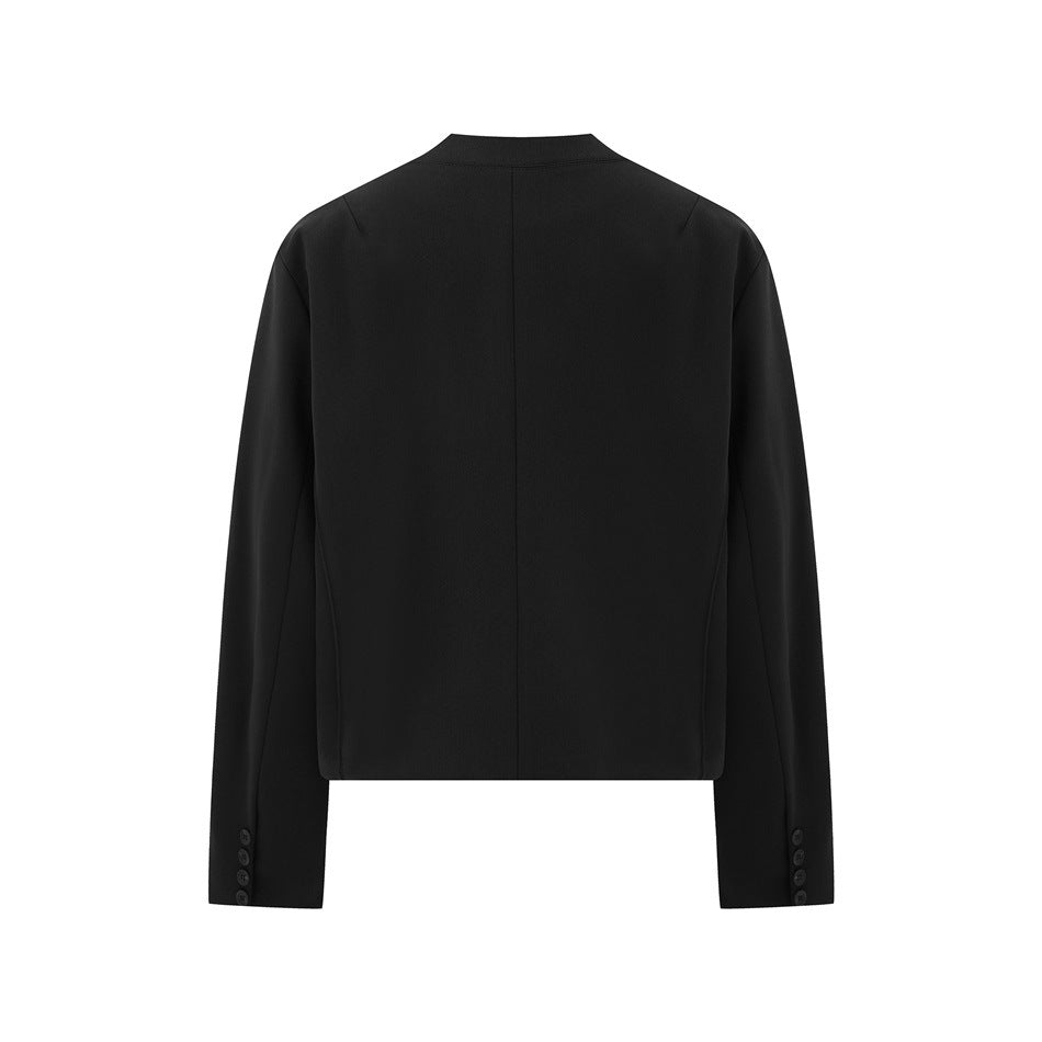 Back view of a black long-sleeve jacket with a short stand collar, center seam, and buttoned cuffs.