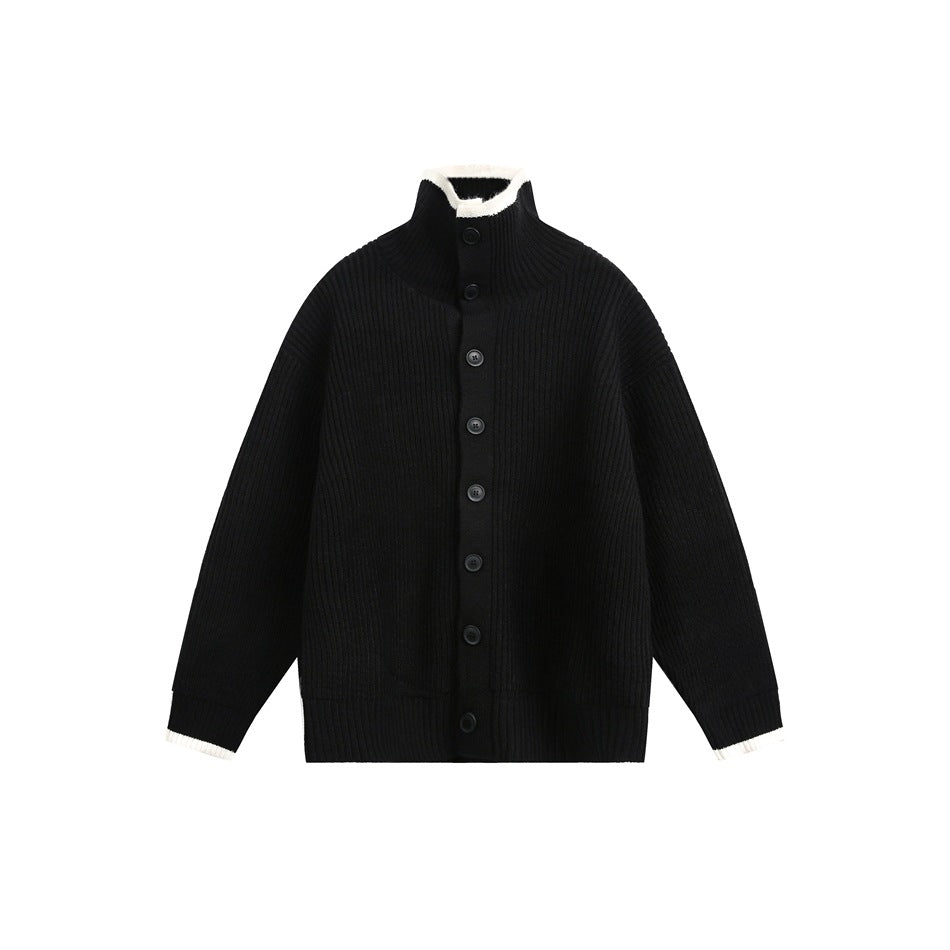 Black ribbed-knit button-front cardigan with stand collar and off-white trim on collar and cuffs, flat lay