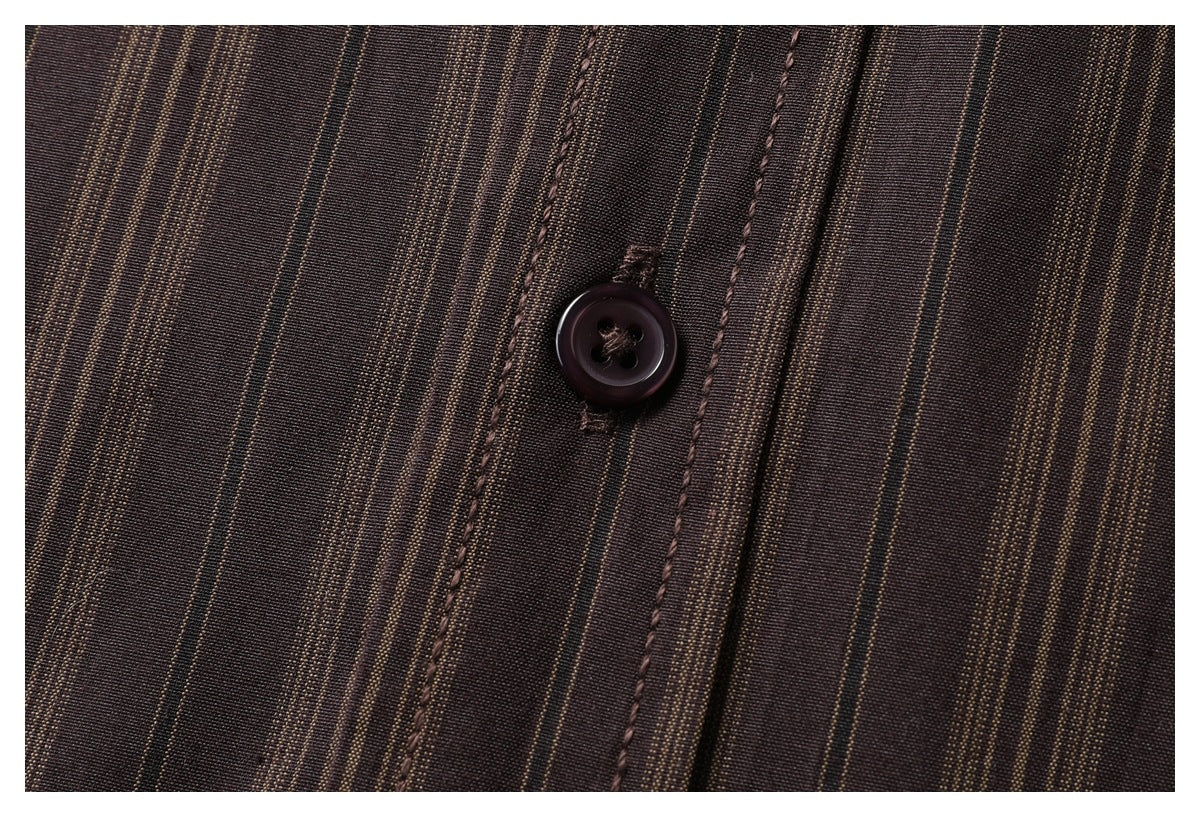 Close-up of a dark button and stitched placket on a dark brown shirt with narrow tan stripes.
