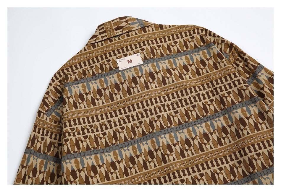 Back view of a flat-laid shirt with a collar and repeating brown, tan, and muted blue geometric bands.