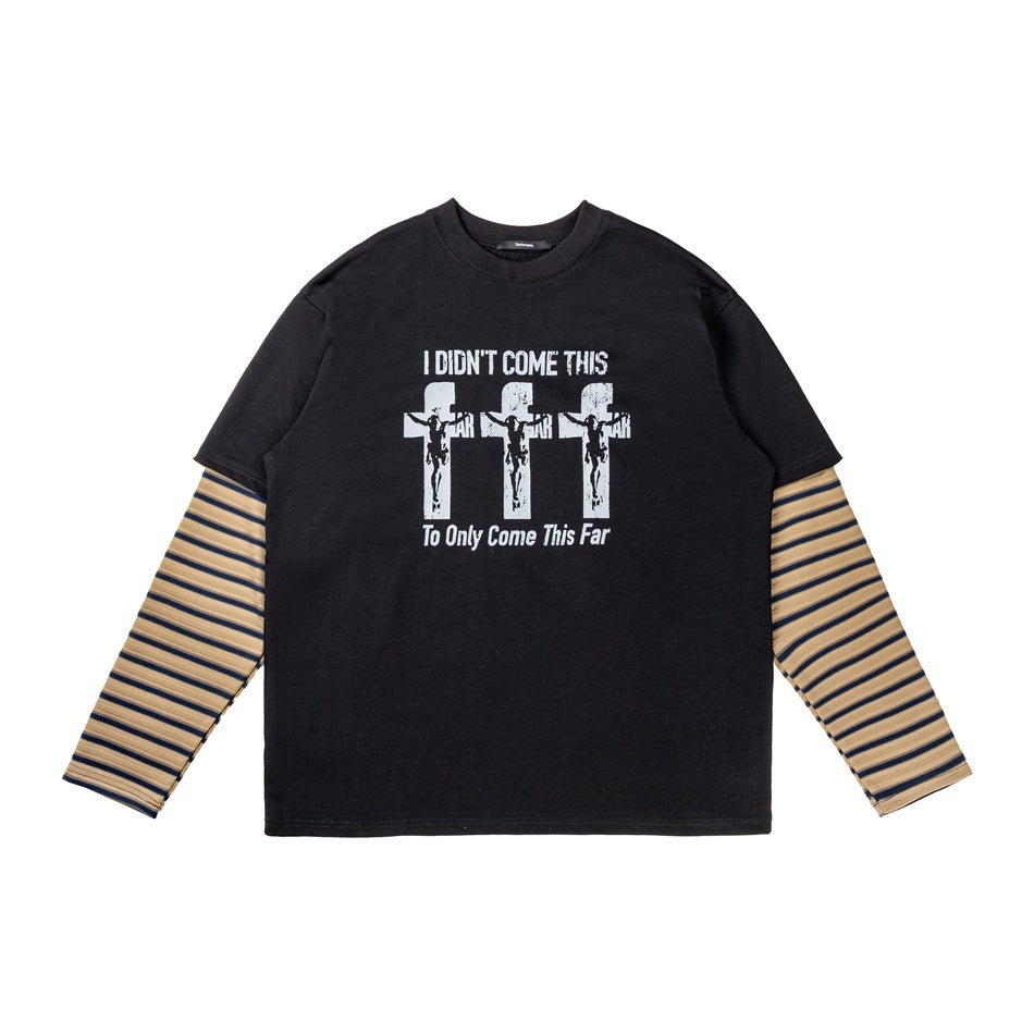Black layered-look pullover with white cross graphic and khaki navy striped sleeves, flat lay front view