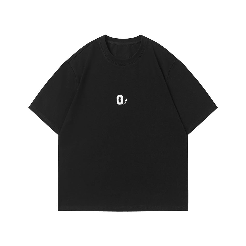 Black crew-neck short-sleeve T-shirt with a small white stylized Q graphic at center chest, flat front view