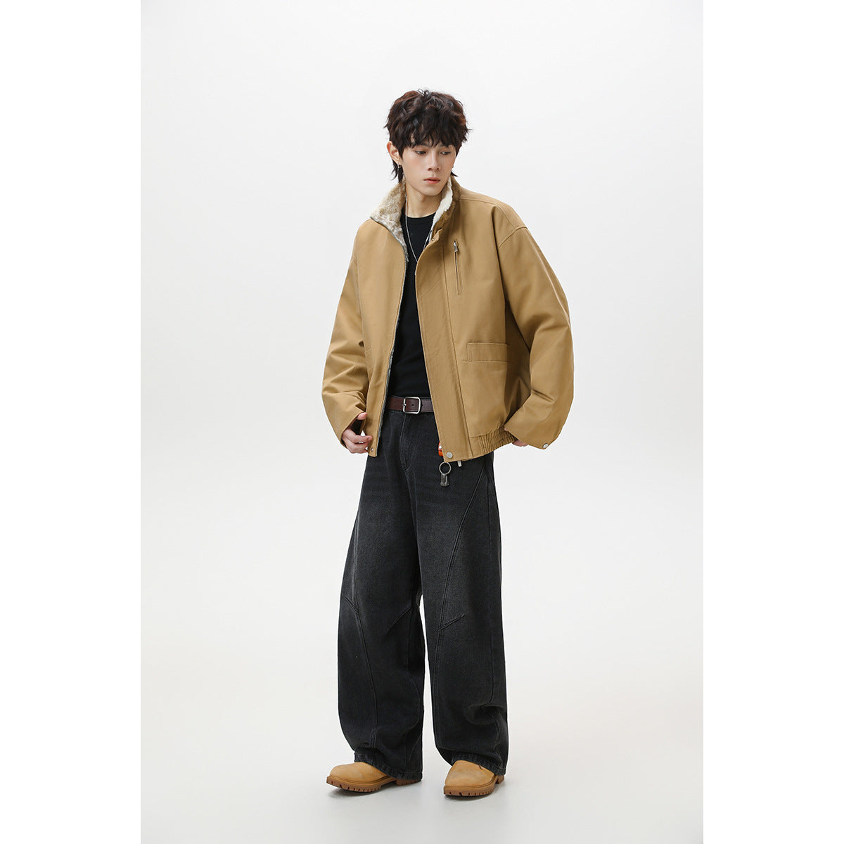 Full-length model wearing a tan fleece-collar jacket with black wide-leg trousers.