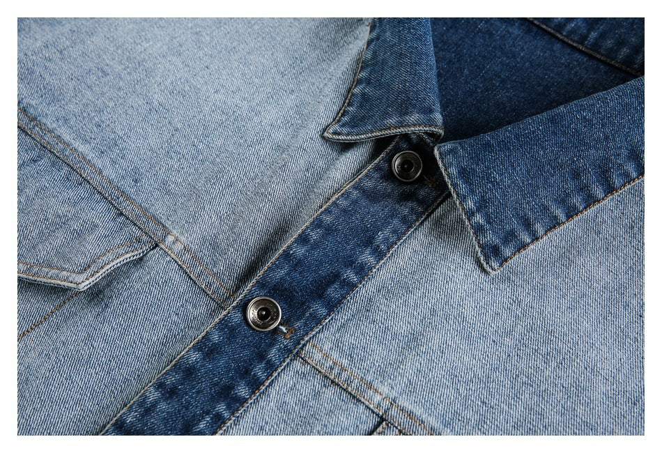 Close-up of the jacket's dark denim collar, contrast placket, and black buttons.