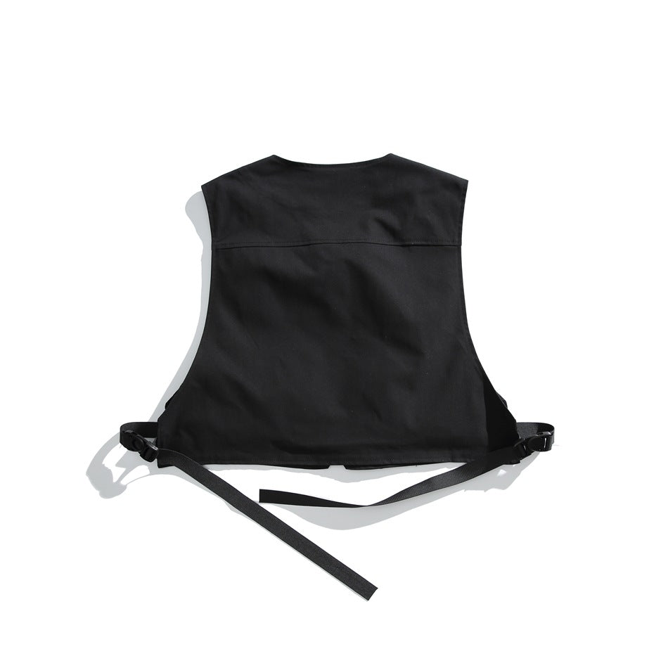 Back of a black sleeveless vest with black adjustable side straps, laid flat on a white background.