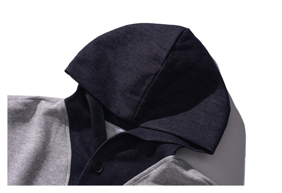 Close-up of the charcoal hood and neckline against the gray shoulders of the hoodie.
