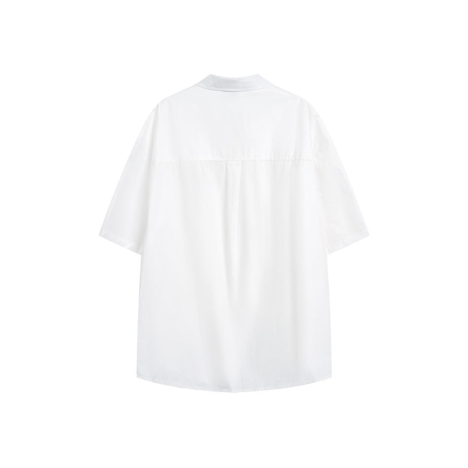 Back view of a white short-sleeve shirt with a back yoke seam and center pleat, flat lay