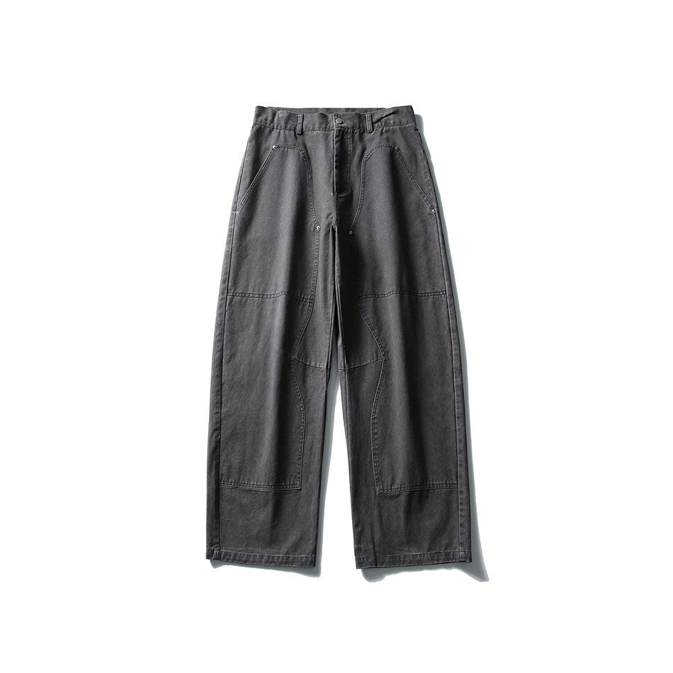 Front flat lay of washed gray wide-leg pants with knee panel overlays and contrast topstitching